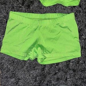 Two child’s large green athletic shorts